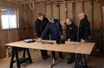 Workers Laying out a Kitchen Remodel